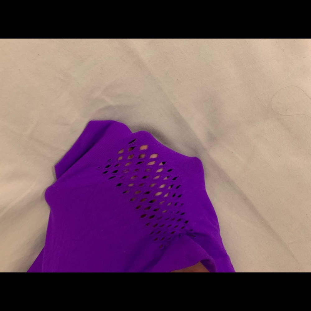 Size M/L nylon stretch boyshorts w/ fishnet detailing on side. Electric purple.